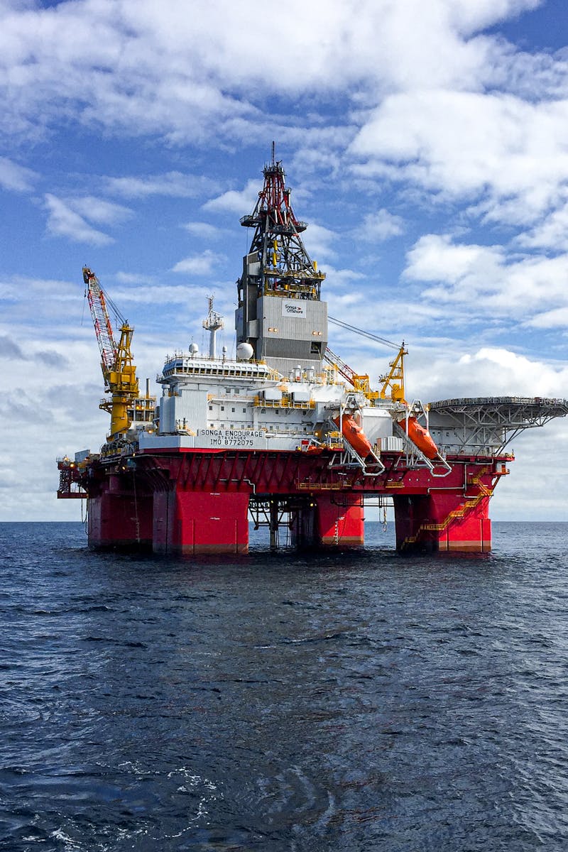 Majestic offshore oil platform under a bright sky in the North Sea, showcasing Norway's energy infrastructure.