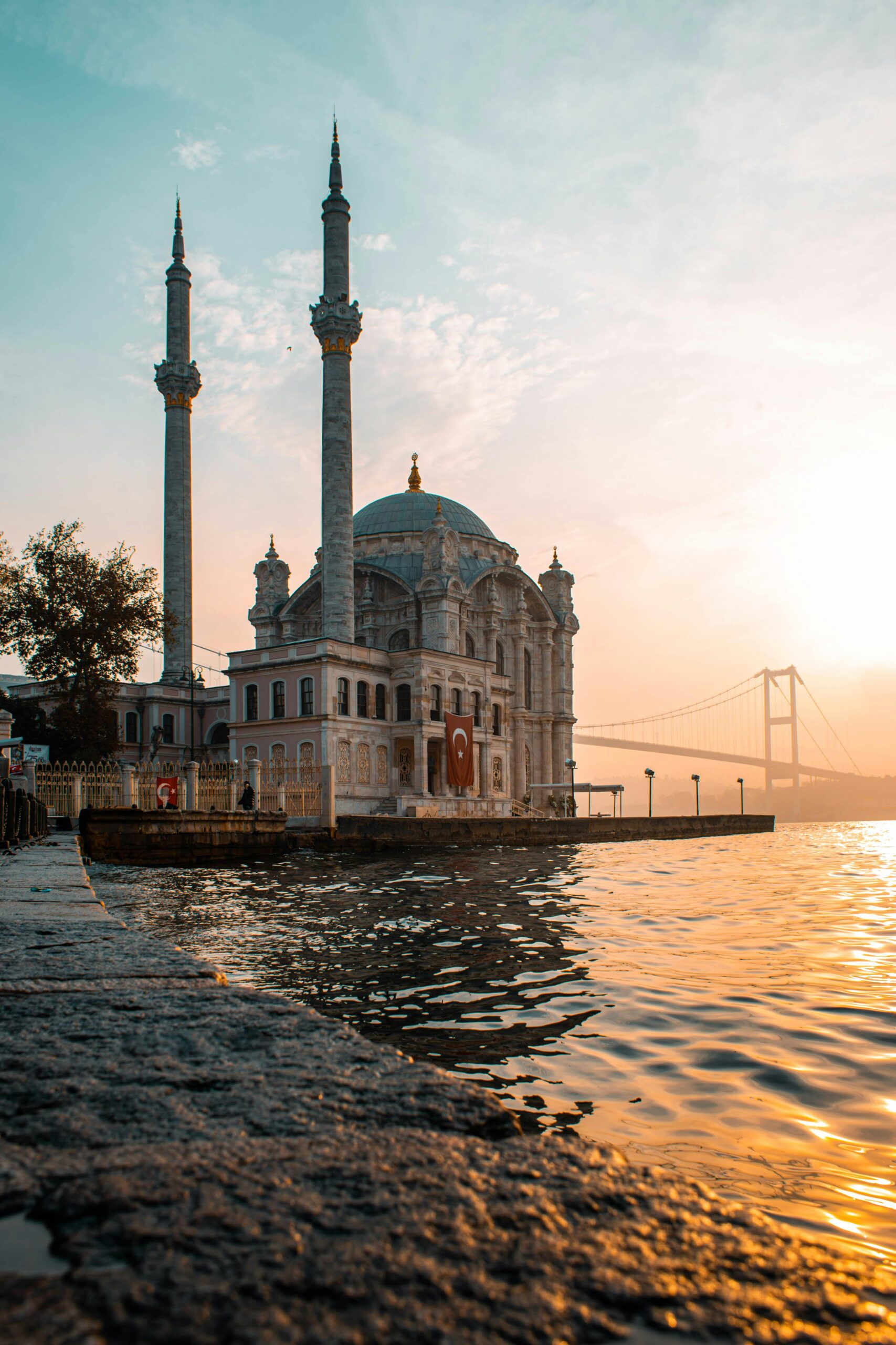 Ortaköy Mosque by the Bosphorus at sunset, capturing the harmony of architecture and landscape in Istanbul.
